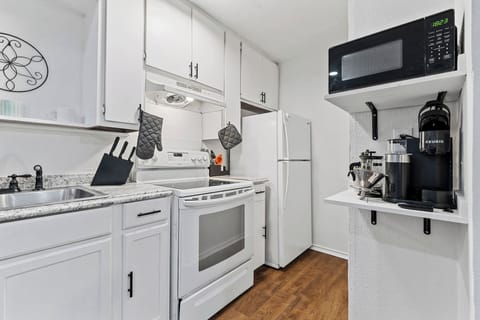 The kitchen has a dedicated area for coffee (Keurig machine!), microwave, and blender (not pictured) in the kitchen.