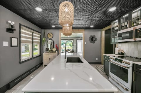 Kitchen centers around a extra large island with double sink.