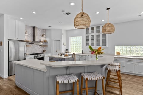 Sleek, spacious, and ready for gathering — This beautifully designed kitchen combines upscale finishes with a welcoming layout, perfect for everything from morning coffee to family-style dinners.