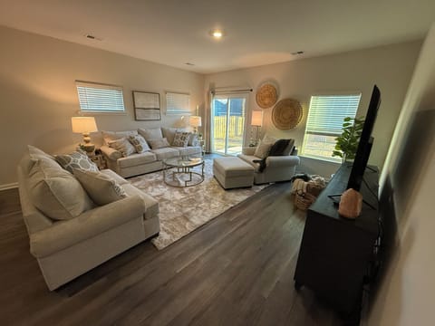 Enjoy family gatherings in a spacious living room with a queen sofa bed