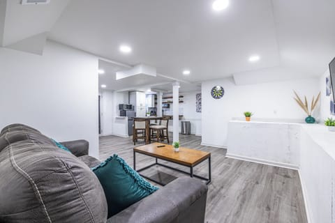 From meal prep to movie night to game time, this open-concept living room with a view of the kitchen lets you do it all.