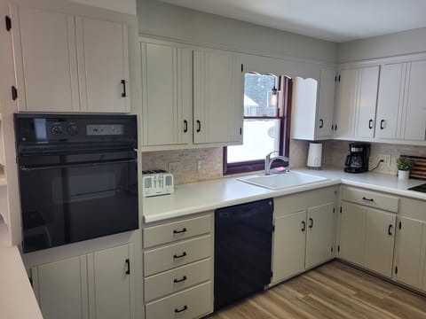 KITCHEN:  The home has a large and modern kitchen with all appliances including a dishwasher.  There is also a good supply of cooking and dining utensils.