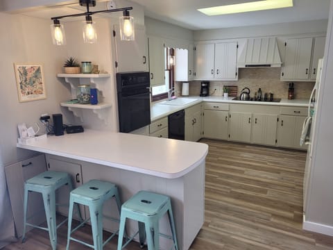 KITCHEN:  The home has a large and modern kitchen with all appliances including a dishwasher.  There is also a good supply of cooking and dining utensils.