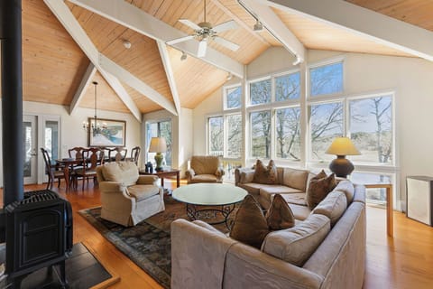  Open-concept living with water views & cozy seating.