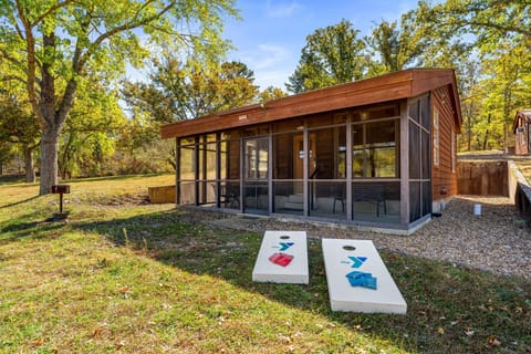 Enjoy outdoor fun with cornhole boards set up just outside the cabin.