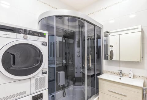 Bathroom includes hydro-massage, steam and chromo-therapy shower cubicle; bede; washing machine; and tumble dryer