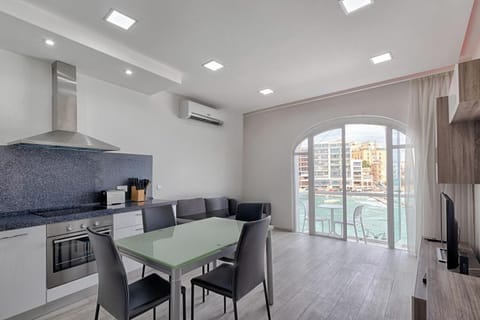 Kitchen / living / dining leading to sea-view private balcony