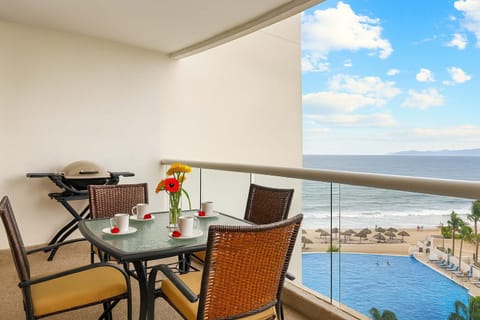 Unwind on your private balcony with ocean breezes.