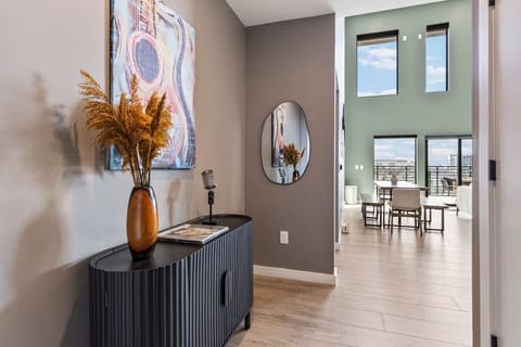 Bright and spacious living room off the kitchen. Smart TV, remote controlled room darkening shades, and pull-out sleeper sofa for ultimate comfort. Dining table that can seat 8 people.