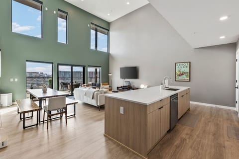 Fully equipped kitchen with modern appliances and ample counter space perfect for cooking a meal. Large island including seating for 5.