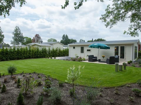 Blue, Chair, Outdoor Furniture, Design, Shade, Outdoor Table, Eco Hotel, Patio, Houseplant, Daylighting