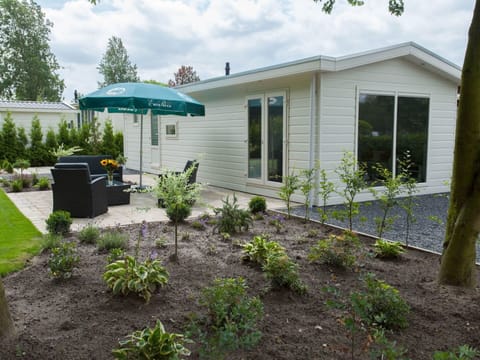 Blue, Chair, Outdoor Furniture, Design, Shade, Outdoor Table, Eco Hotel, Patio, Houseplant, Daylighting
