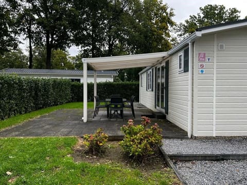 Blue, Chair, Outdoor Furniture, Design, Shade, Outdoor Table, Eco Hotel, Patio, Houseplant, Daylighting