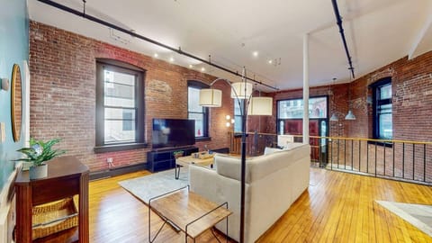 Spacious living room with a comfortable sofa.
