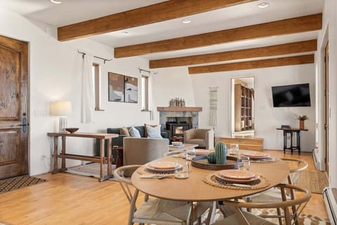 Professionally decorated La Casita with an open-concept style kitchen, dining, and living room (sofa is a queen pull out couch. PLEASE NOTE: living room fireplace currently does not work).