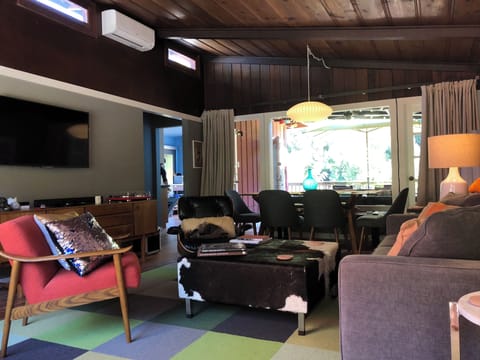 Open to the dining area and doors to the back deck - mini-splits for heating and A/C in each bedroom and living room.