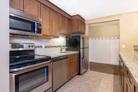 Well-equipped kitchen with modern appliances, ideal for preparing meals and enjoying home-cooked dining experiences.