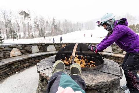 Unwind after a day on the slopes with a fireside moment, where crisp mountain air meets the warmth of a crackling flame.