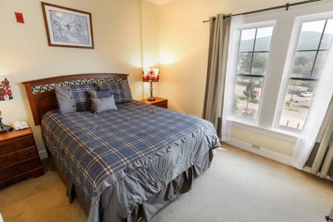 A cozy bedroom with natural light and soft bedding for a peaceful night’s rest.