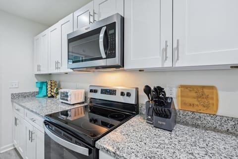 Fully stocked kitchen with stove, oven, microwave, pots/pans, cooking utensils, coffee and so much more