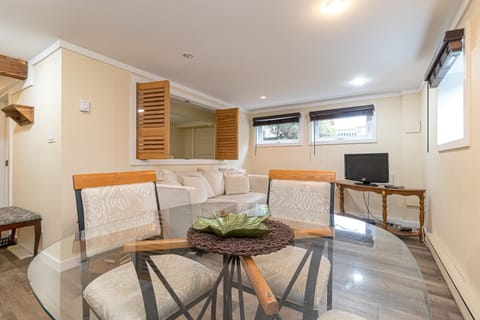 Cozy living room with comfortable sofa, smart TV and natural light