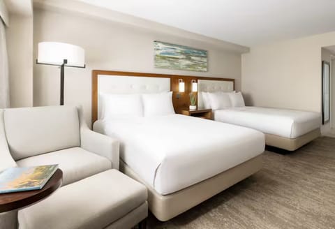 Stretch out with two plush beds and a cozy sitting nook.
