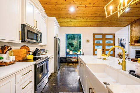 The bright and airy kitchen is equipped for all your cooking needs