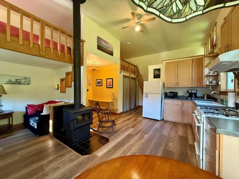 Open floor plan with Hang Out Nook to left, two sleeping lofts with ladders.
