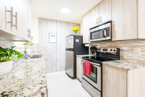 Indulge in a chef-worthy kitchen featuring high-end appliances