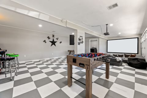 Fun game room with foosball, home theater, and lounge area