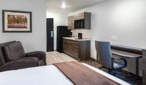 Settle into your spacious suite with kitchenette and work desk.