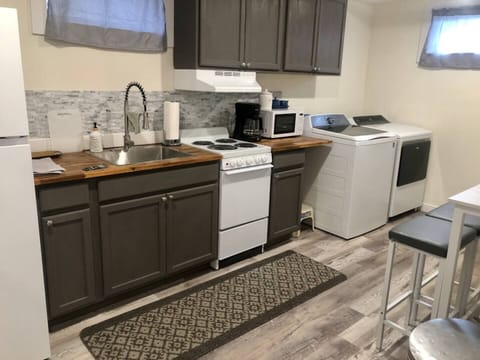 Equipped with coffee maker, microwave, refrigerator, oven and stove. Stocked with dishes, silverware, coffee mugs, and glasses and basic cookware.