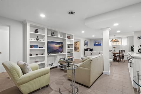 "Relax and recharge in the cozy living room, featuring a full sleeper sofa and Smart TV for a comfortable stay.