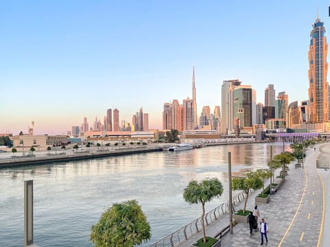 Scenic View: Unwind with breathtaking waterfront views and vibrant city skyline at sunset!