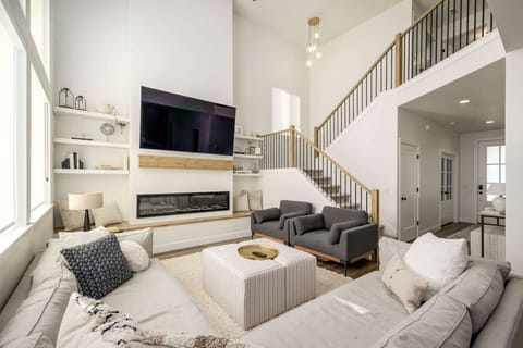 Bright living room with fireplace and vaulted ceilings
