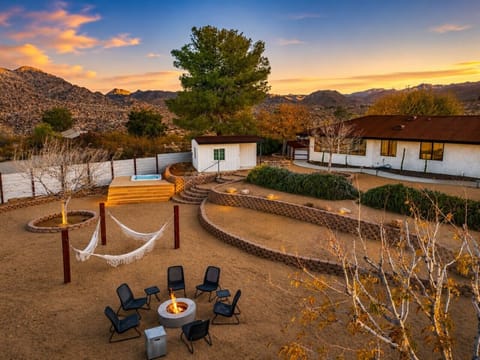 Private desert retreat with mountain views, fire pit, hammocks, hot tub, and stunning sunsets • Just minutes from Joshua Tree National Park.