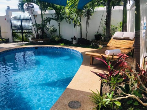 pool area to take a dip and relax with a cold drink from our self service bar 