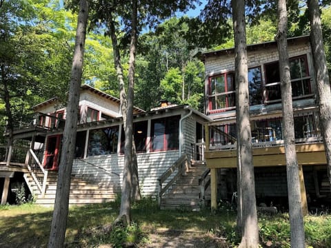 View of cottage- 3 decks and 2 tree house like primary suites