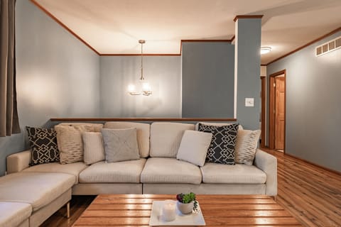 Bright lounge area off of the kitchen for people to watch tv or gather and talk