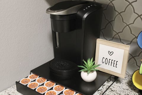 Coffee Corner: Brew your perfect cup with a sleek machine and complimentary pods for ultimate comfort!