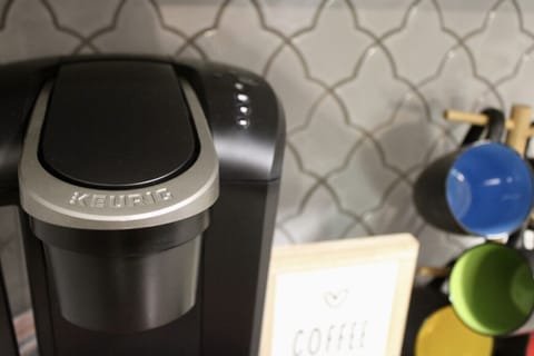 Coffee Corner: Brew your morning magic with a modern Keurig and colorful mugs just for you!