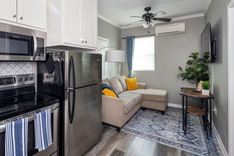 Enjoy sunny afternoons on the stylish sofa with bright accents and modern comforts.