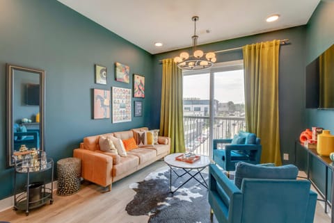 Stylish space with bold colors, eclectic art, and inviting views for perfect relaxation!