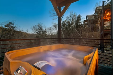 Unwind under the stars in your private hot tub with stunning mountain views!