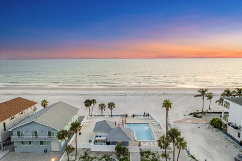 Aerial view of the pool area looking towards the beach.