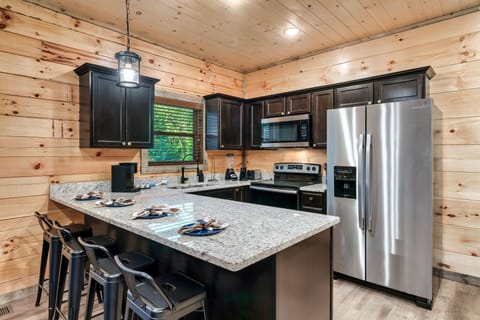 The kitchen has all essential utensils, cookware, and appliances. Chef's kiss!