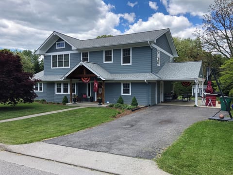 Front of house. Parking in driveway and on street.