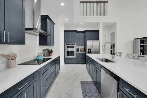 Spacious kitchen with double ovens and island—great for cooking together.