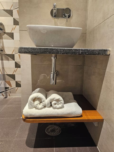 Fresh towels are always stacked.