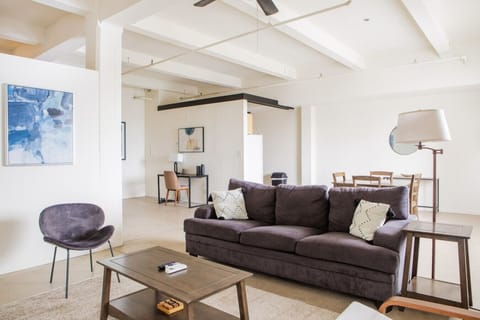 Spacious living room with city skyline views